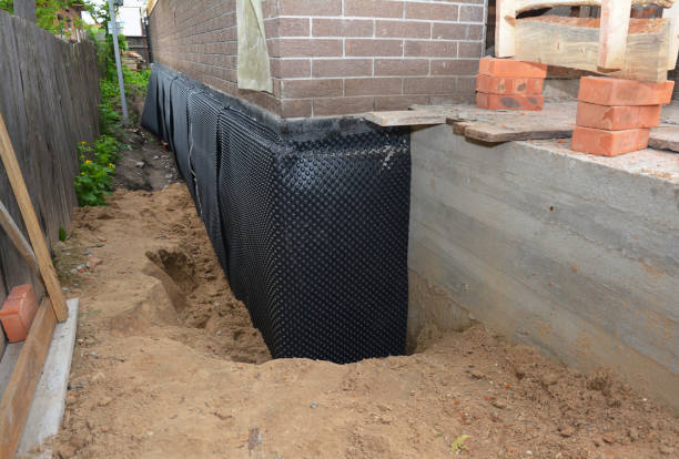 Happy homeowners after waterproofing job in Aquasco